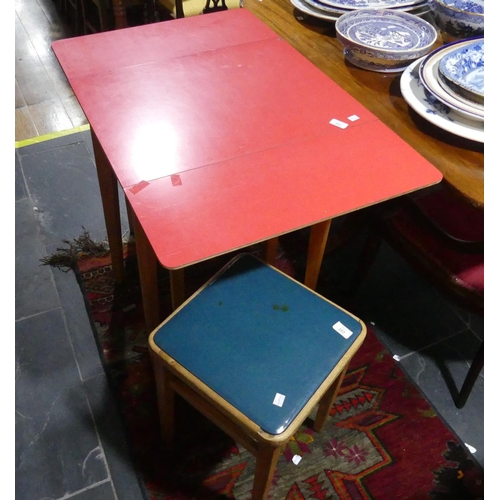 357 - A vintage Remploy red formica drop-leaf Table, together with three stools (4)