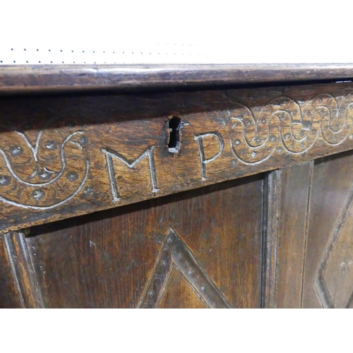 399 - A 17th century and later oak Coffer, the hinged lid above carved frieze and three carved panels, on ... 