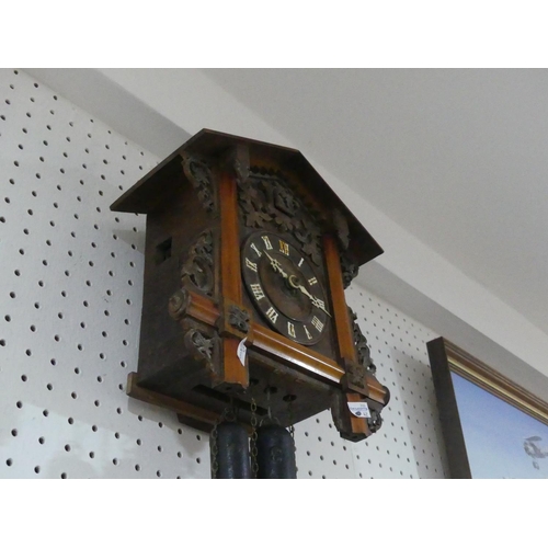 400 - An early 20th century Black Forest Cuckoo Clock, with pendulum and two weights, the case 12½in (32cm... 