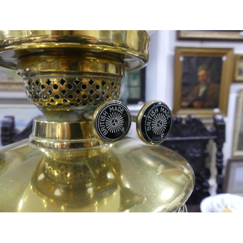 409 - An Edwardian brass Oil Lamp, of classical column form on stepped square base, with white glass shade... 