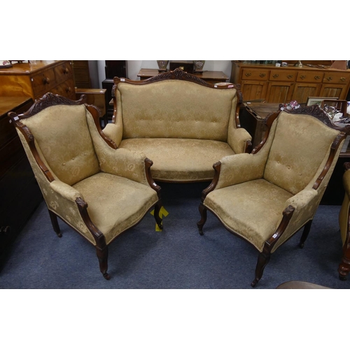 411 - An Edwardian mahogany-framed two-seater Salon Sofa, the carved top rail above the cream and golden u... 