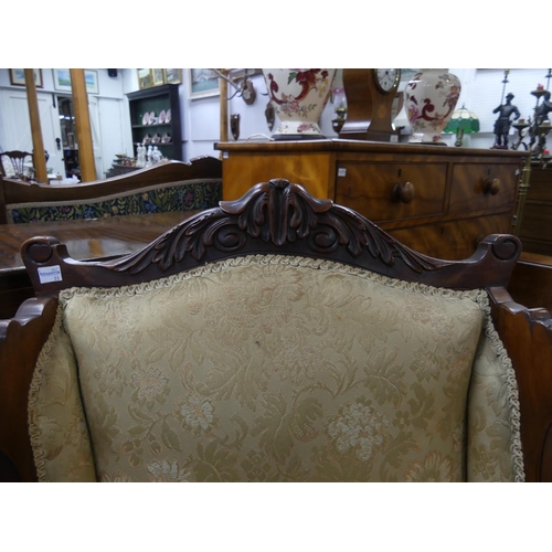 411 - An Edwardian mahogany-framed two-seater Salon Sofa, the carved top rail above the cream and golden u... 