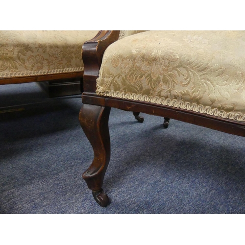 411 - An Edwardian mahogany-framed two-seater Salon Sofa, the carved top rail above the cream and golden u... 