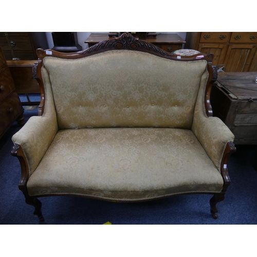 411 - An Edwardian mahogany-framed two-seater Salon Sofa, the carved top rail above the cream and golden u... 