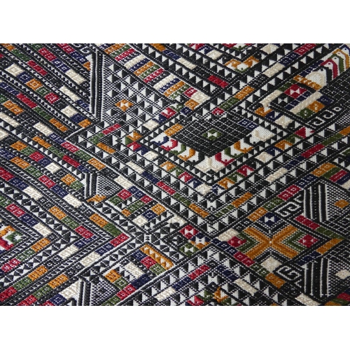 414 - A vintage Cambodian silk Table Runner, with coloured thread geometric decoration and tassels, appx. ... 