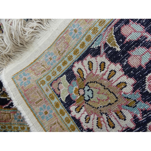 416 - Tribal Rugs: A Kashmiri silk rug, cream ground woven with black and pink traditional patterns, pile ... 