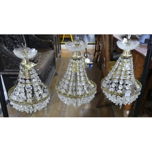 419 - A mid 20thC brass and crystal three-branch Chandelier, together with a three tier circular brass and... 