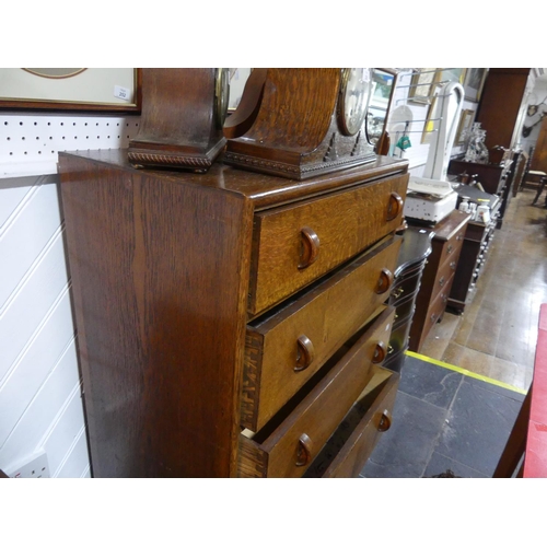 433 - A mid-20th century oak Chest of Drawers, by Herbert E. Gibbs, the five graduated drawers with half-h... 