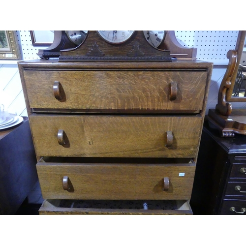 433 - A mid-20th century oak Chest of Drawers, by Herbert E. Gibbs, the five graduated drawers with half-h... 