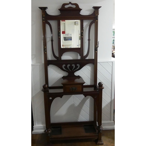 435 - An Edwardian Art Nouveau style mahogany Hallstand, by James Shoolbred & Co., of pierced and moulded ... 