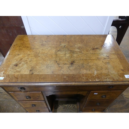 440 - A George III style walnut kneehole Desk, the rectangular top with moulded edge above a frieze drawer... 