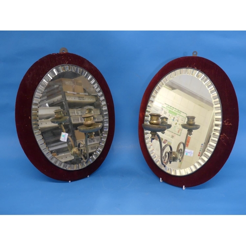 443 - A pair of Edwardian oval girandole Mirrors, with red velvet lined frames, the oval plates with facet... 