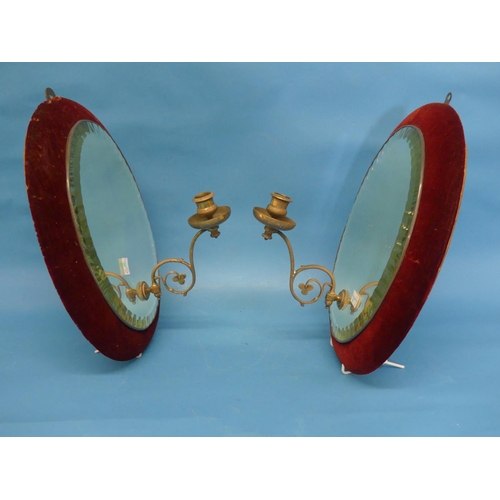 443 - A pair of Edwardian oval girandole Mirrors, with red velvet lined frames, the oval plates with facet... 