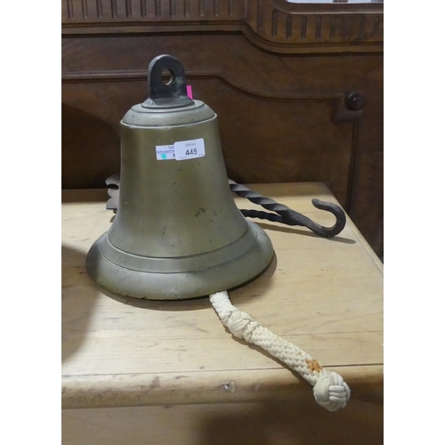 445 - A vintage brass Ships Bell, with associated iron bracket, bell: 11in (28cm) high x 10in (25.5cm) dia... 