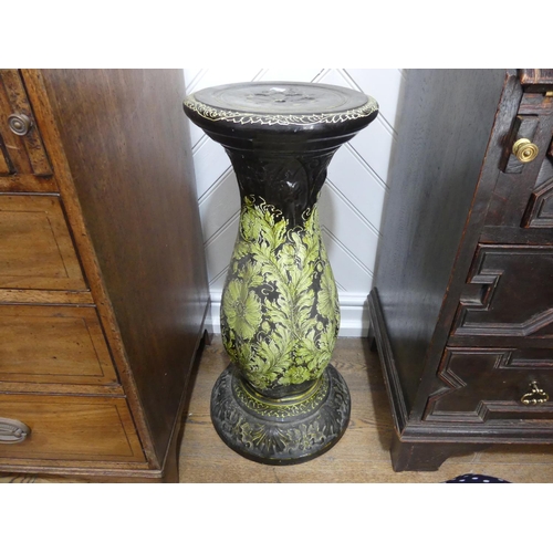 71 - An early 20th century pottery Jardiniere Stand, green ground with tube-lined floral decoration, 28in... 