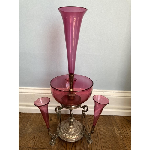 80 - An Edwardian cranberry glass and silver plated Epergne, with a central trumpet vase and bowl surroun... 