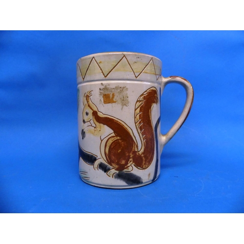 82 - A large Brannam Pottery Mug, naively adorned in sgrafitto decoration each side with red squirrels on... 