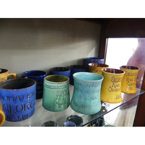 84 - A large collection of Brannam Pottery Commemorative Ware, together with a plain blue Baron Barnstapl... 