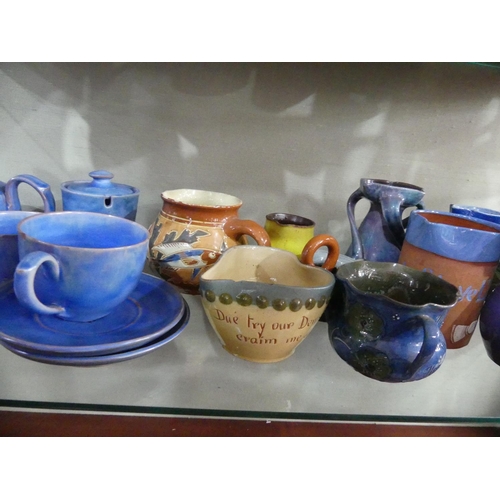 84 - A large collection of Brannam Pottery Commemorative Ware, together with a plain blue Baron Barnstapl... 
