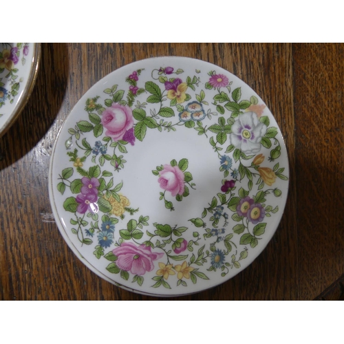 85 - A crown staffordshire Tea Service, reg. no 622733, with foliate border of pansies roses etc., compri... 