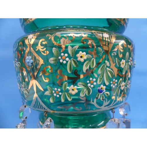88 - A Victorian castle-topped green glass Lustre, painted in coloured enamels and gilt with floral decor... 