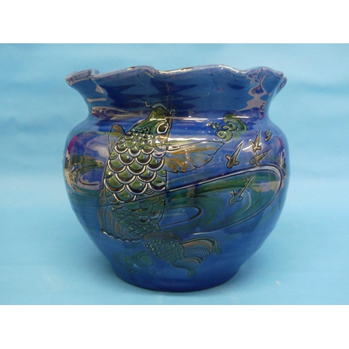 98 - A large C. H. Brannam (Barnstaple) pottery Jardiniere, ovoid with wavy rim,  the blue-ground body sg... 