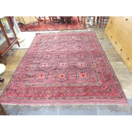 395 - Tribal rugs; an old Turkmen, possibly Ersari, red ground rug, finely woven and hand knotted with rep... 