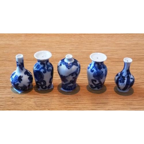 164 - Eight Chinese porcelain blue and white 'Doll's House' Miniature Vases, Qing dynasty, with floral dec... 