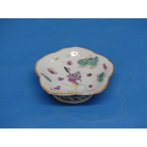 189 - A 19th century Chinese famille rose porcelain Dish, of lobed oval form with floral decoration, chipp... 