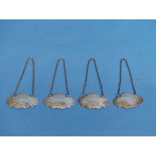55 - A set of four George V silver Wine Labels, by S Blanckensee & Son Ltd., hallmarked Birmingham, 1... 