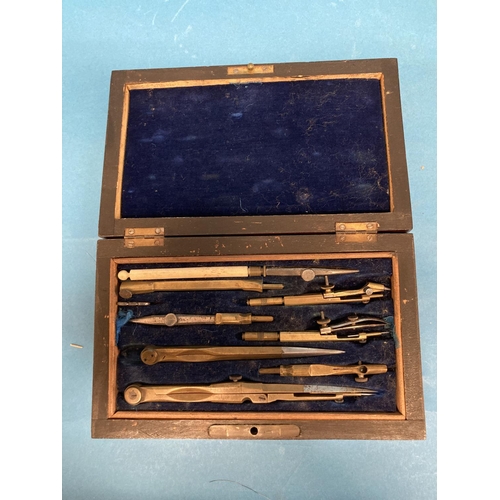 35 - An early 20thC mahogany cased set of Draughtsman Implements, containing a compasses etc.... 
