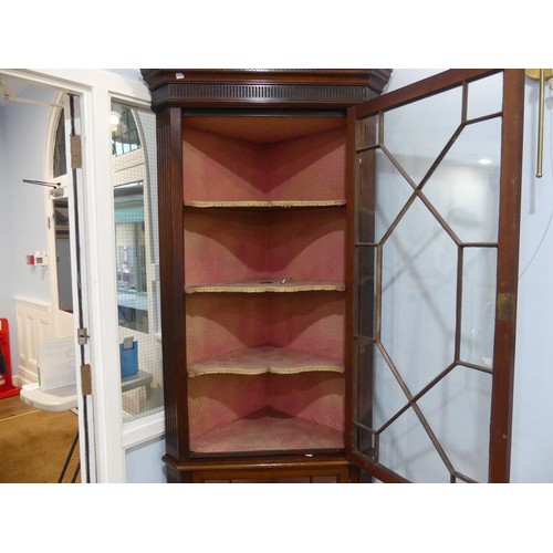 295 - An early 20thC mahogany Floor Standing Corner Cupboard, the astragal glazed cupboards with shelved i... 