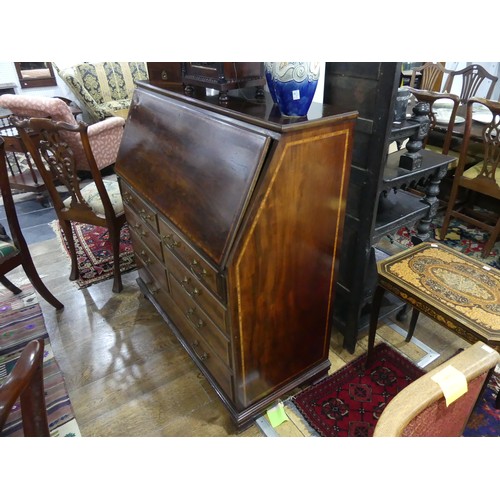 308 - An Edwardian mahogany and inlaid Bureau by Thomas Turner of Manchester, the fall front with integrat... 