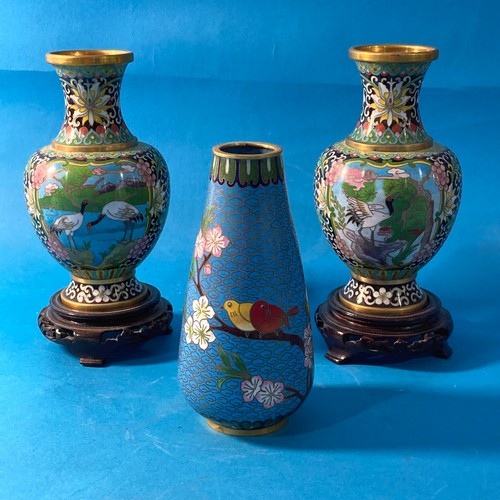 88 - A pair of 20thC Cloisonné baluster Vases, the lids surmounted with kylins, raised on hardwood stands... 