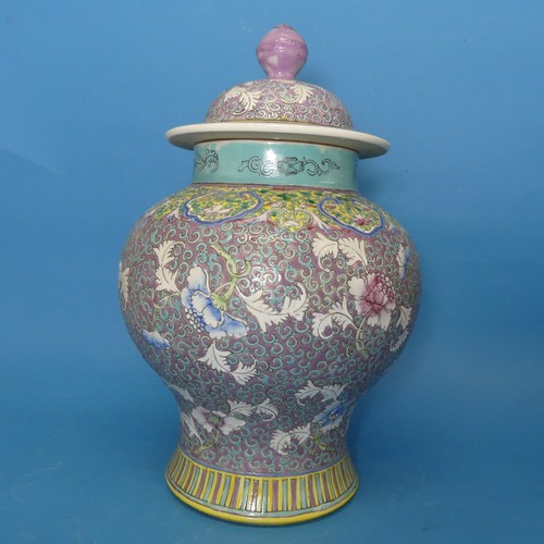 93 - A Chinese Republican period porcelain Temple Jar and Cover, decorated in enamels of purple, blues an... 