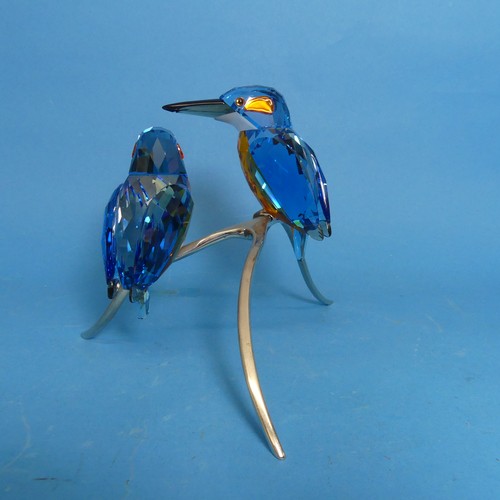 112 - A Swarovski Crystal Kingfisher Duo, the two cut glass birds, perched upon metal branch, impressed wi... 