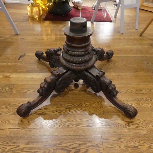 328 - A Victorian heavily carved oak octagonal Drum Table, with octagonal skived in tooled leather top abo... 