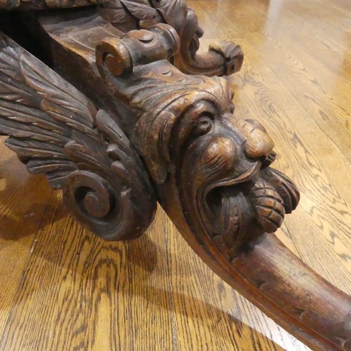 328 - A Victorian heavily carved oak octagonal Drum Table, with octagonal skived in tooled leather top abo... 