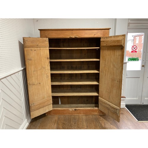 346 - An antique pine Cupboard, the plank doors opening to reveal a shelved interior, W 140cm x H 185cm x ... 