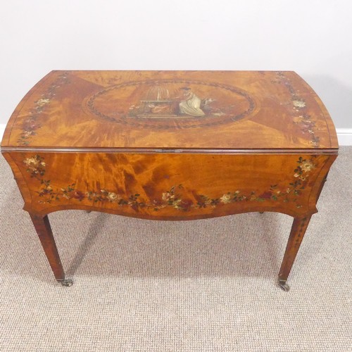 358 - An Edwardian Sheraton revival satinwood and painted Pembroke Table, the quarter-veneered serpentine-... 