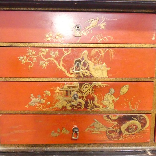 374 - An early 20thC Chinoiserie Chest on Stand, the exterior in black and gold lacquer, decorated with or... 