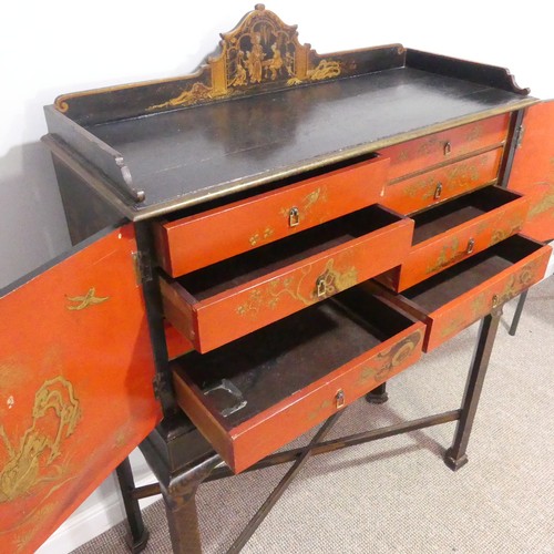 374 - An early 20thC Chinoiserie Chest on Stand, the exterior in black and gold lacquer, decorated with or... 