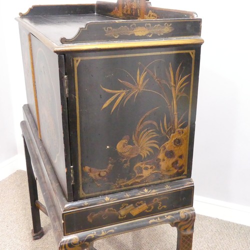 374 - An early 20thC Chinoiserie Chest on Stand, the exterior in black and gold lacquer, decorated with or... 