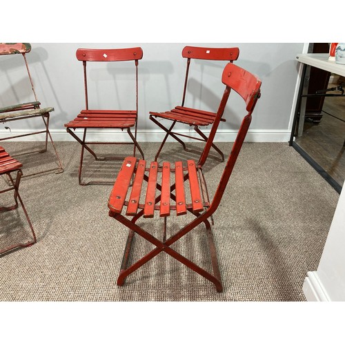 382 - Five folding garden chairs, with red painted wooden slatted seats and backs, one in distressed and w... 