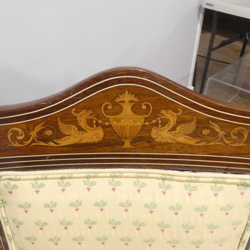 389 - An Edwardian mahogany framed two-seater Ladies Settee, the shaped top rail inlaid with classical urn... 