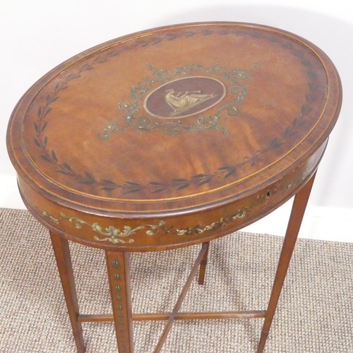 403 - An Edwardian Sheraton revival satinwood and painted oval Work Table, the hinged top, opening to reve... 