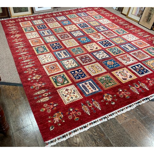 287 - Tribal Rugs; a superb hand-knotted Zeigler carpet, with dark red ground woven all over with squares ... 