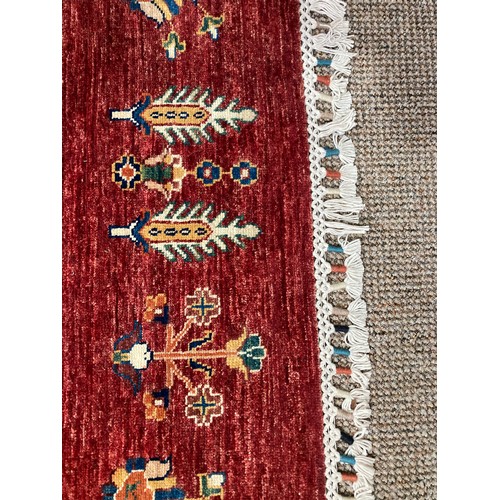 287 - Tribal Rugs; a superb hand-knotted Zeigler carpet, with dark red ground woven all over with squares ... 