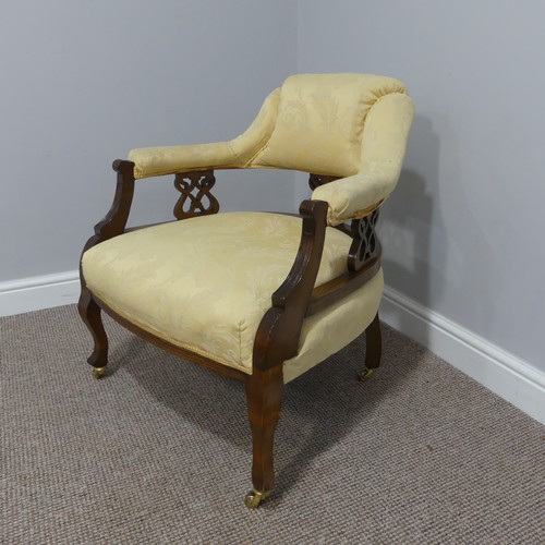 419 - An Edwardian walnut framed Tub Chair, the cream upholstery with pierced back splat, 68cm wide x 67cm... 