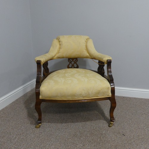 419 - An Edwardian walnut framed Tub Chair, the cream upholstery with pierced back splat, 68cm wide x 67cm... 